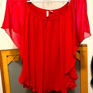 Flowy red blouse.